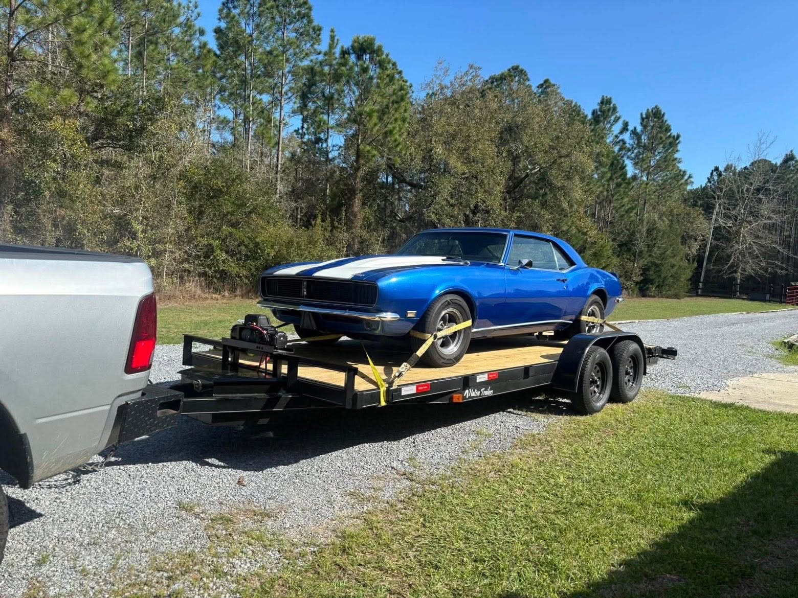 Classic muscle car loaded on the wood deck trailer with the included winch